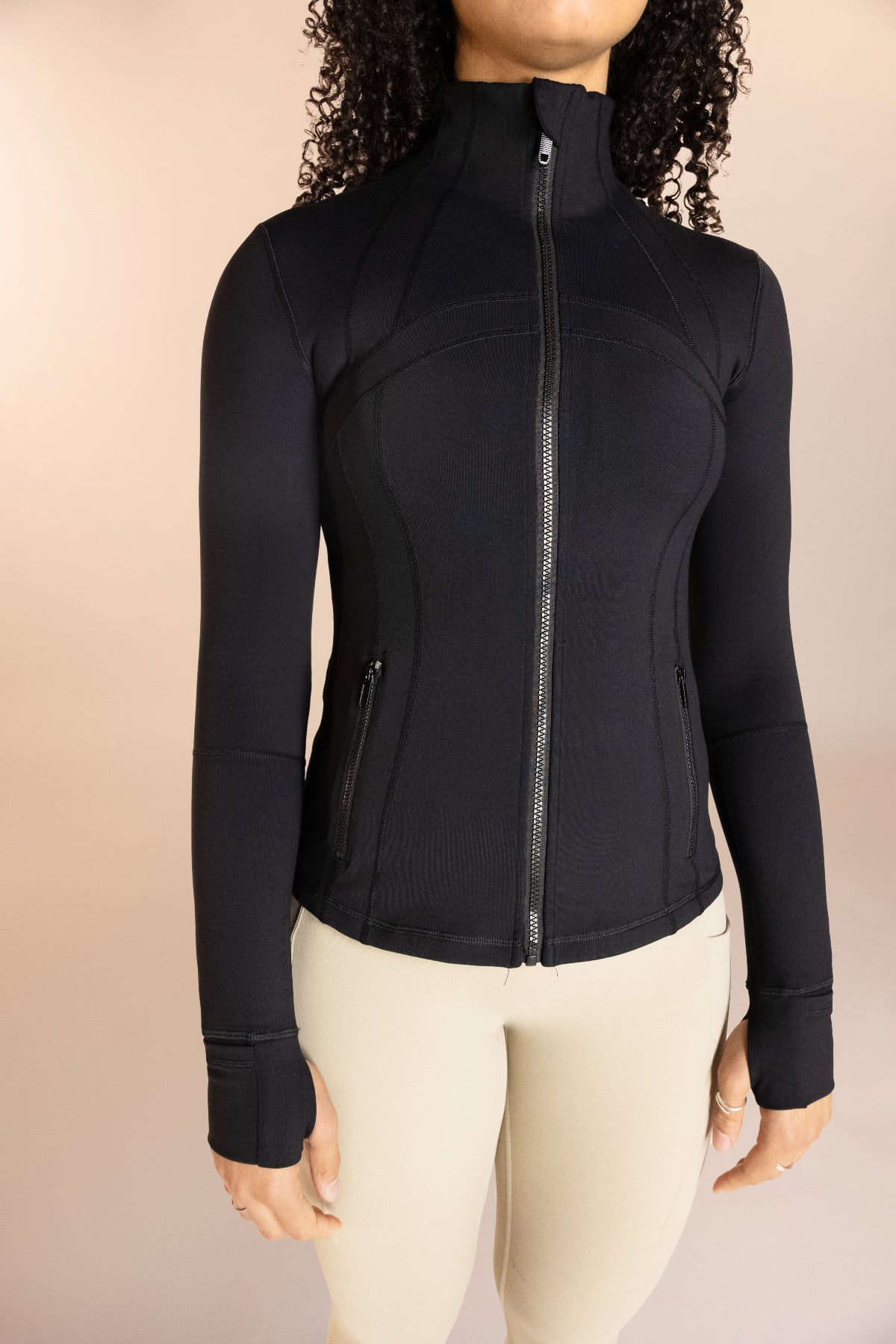 Black form fitting running jacket with pockets 