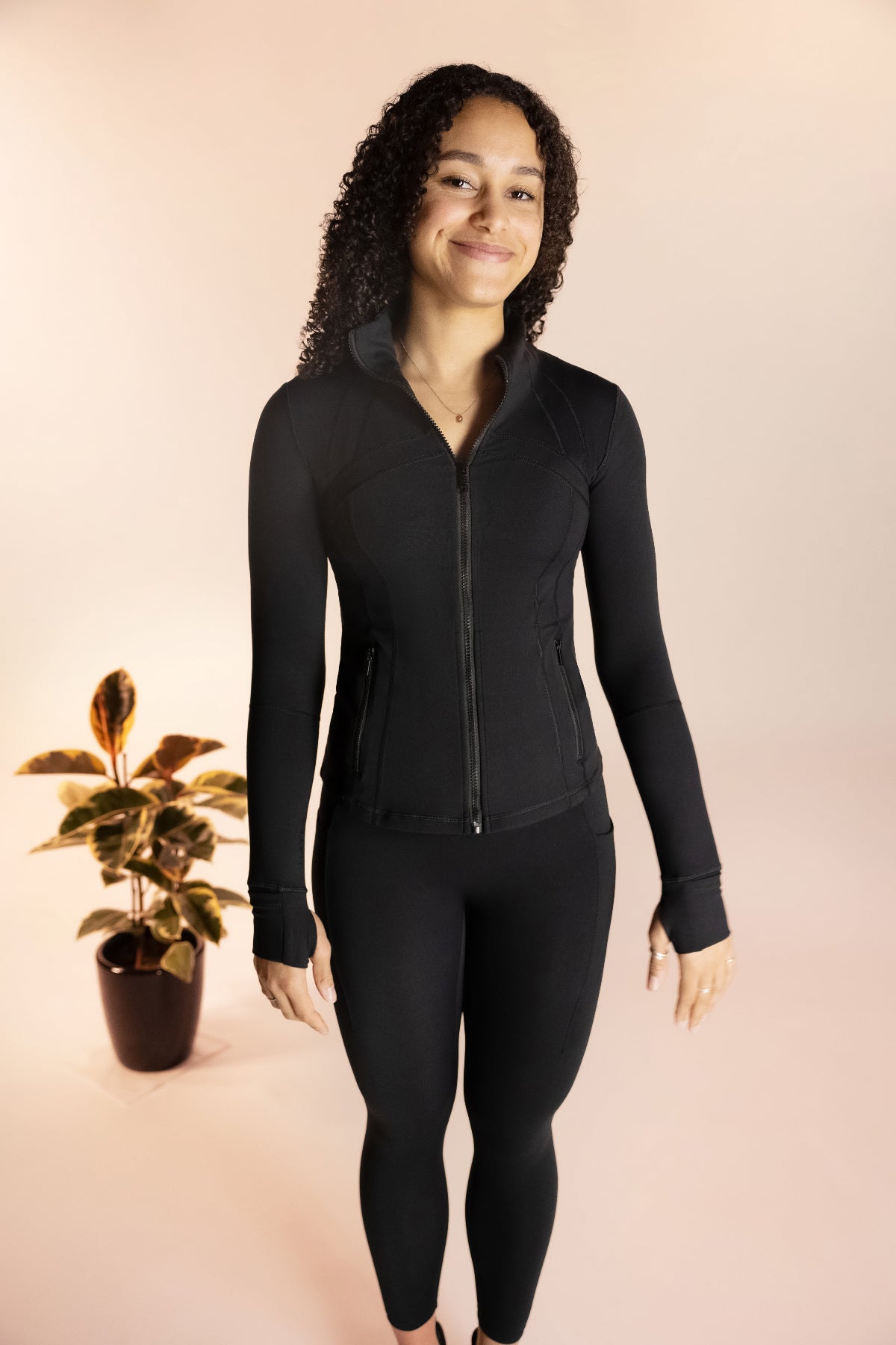 Zip up stretch jacket in black for running